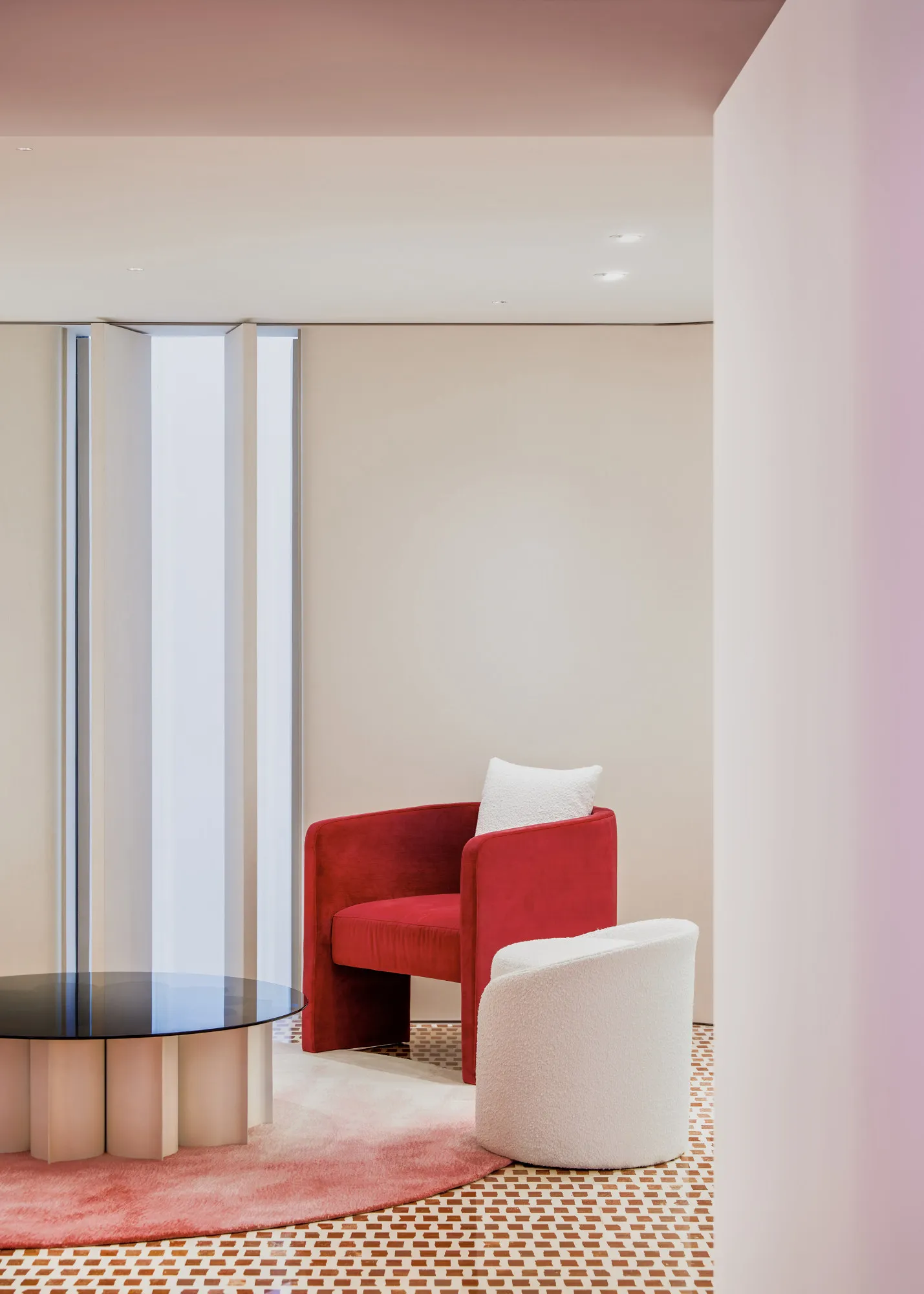 red geometric terrazzo floor and red armchair